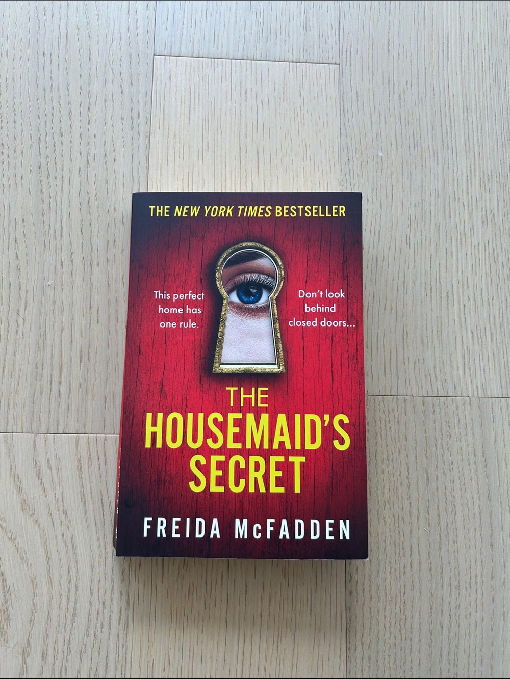The Housemaid's Secret by Freida McFadden - Red & Yellow Paperback